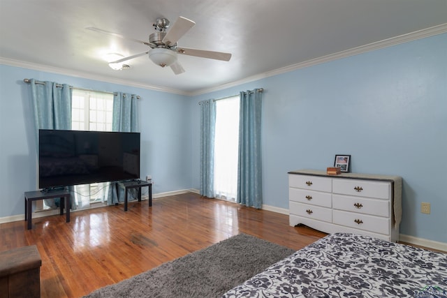 bedroom featuring wood-type flooring, ceiling fan, and ornamental molding