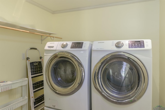 laundry area featuring independent washer and dryer and ornamental molding