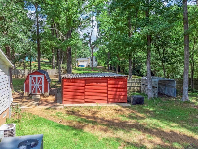 view of yard with a shed and central air condition unit