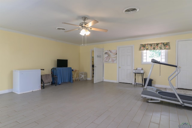 workout room with crown molding and ceiling fan