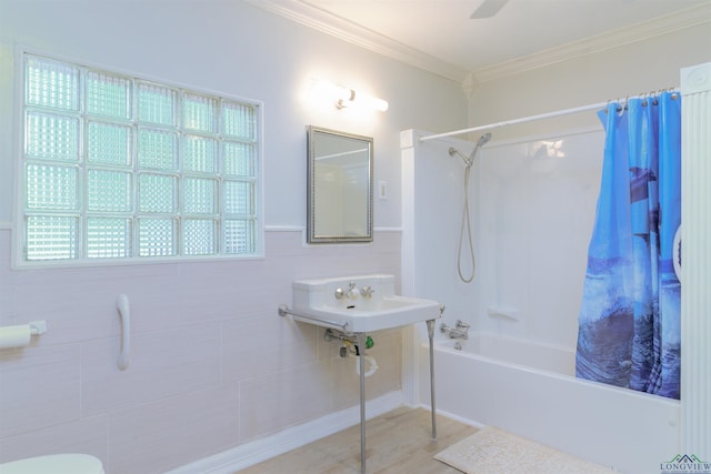 bathroom featuring hardwood / wood-style floors, ceiling fan, shower / bath combo with shower curtain, and crown molding