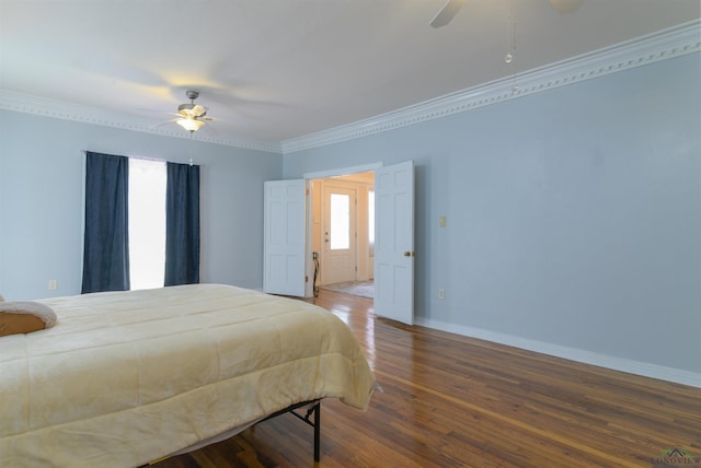 bedroom with hardwood / wood-style floors, ceiling fan, and crown molding