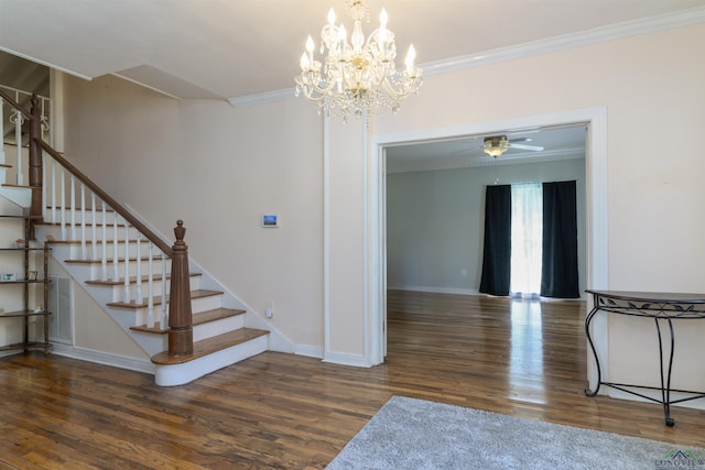 interior space featuring wood-type flooring, ceiling fan with notable chandelier, and crown molding