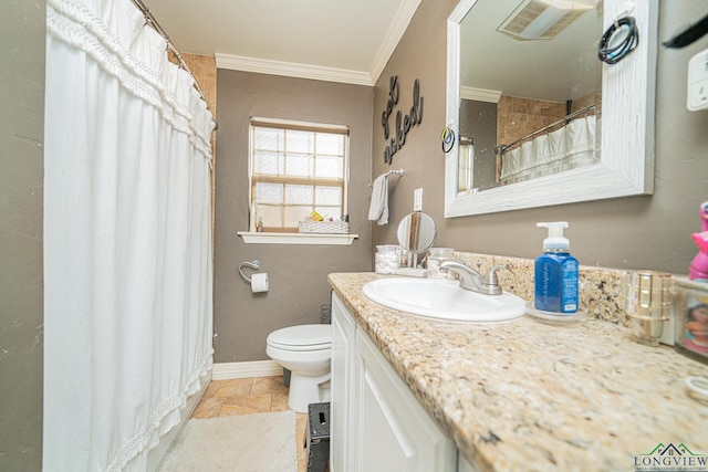 bathroom featuring baseboards, toilet, stone finish flooring, crown molding, and vanity