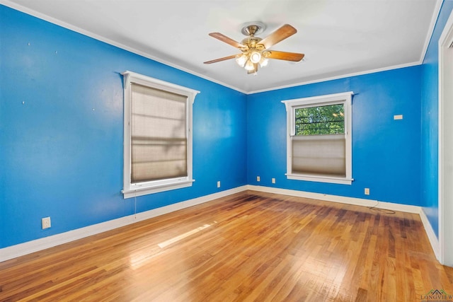 spare room with ceiling fan, ornamental molding, and hardwood / wood-style flooring