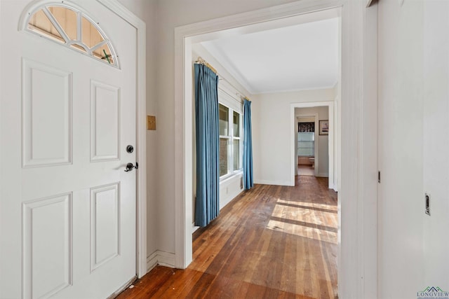 entryway with dark hardwood / wood-style flooring