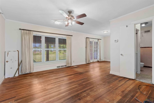 empty room with hardwood / wood-style flooring, ceiling fan, and ornamental molding