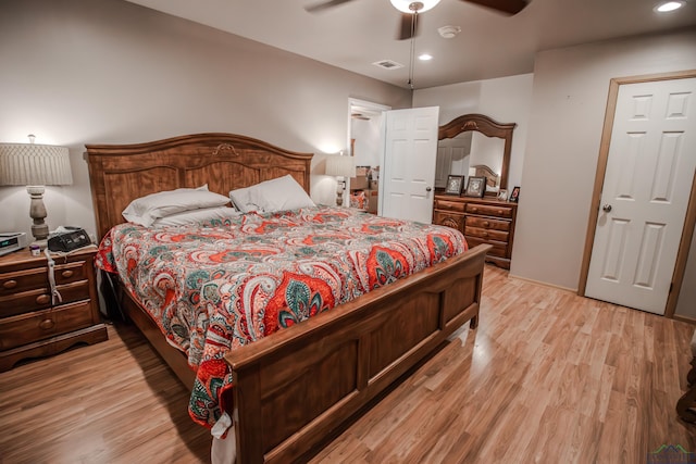 bedroom with ceiling fan and light hardwood / wood-style floors