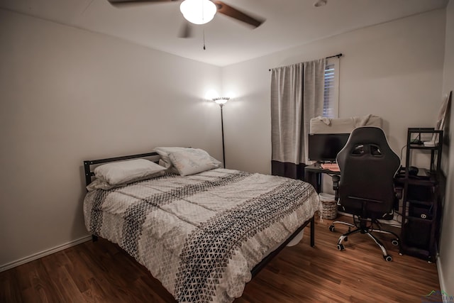 bedroom with ceiling fan and dark hardwood / wood-style floors