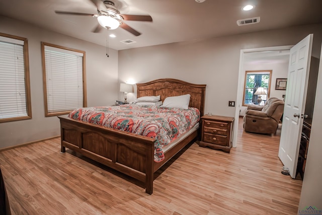 bedroom featuring ceiling fan and light hardwood / wood-style floors