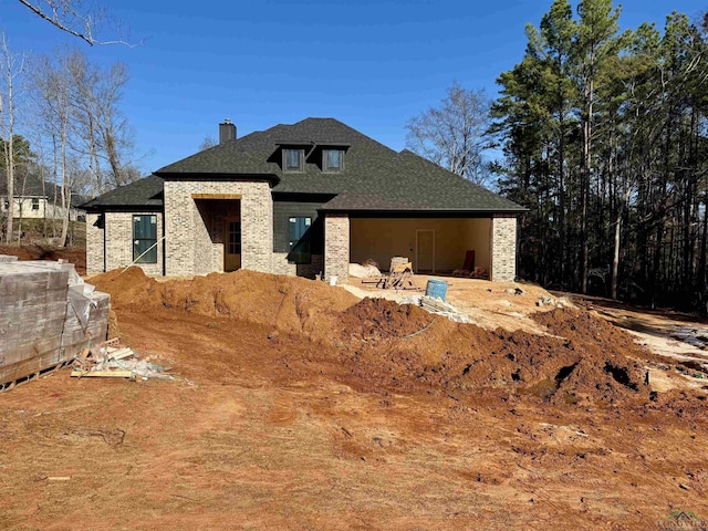 view of front of home with an outdoor structure