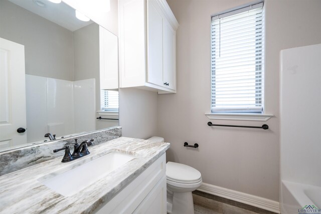 bathroom with vanity and toilet