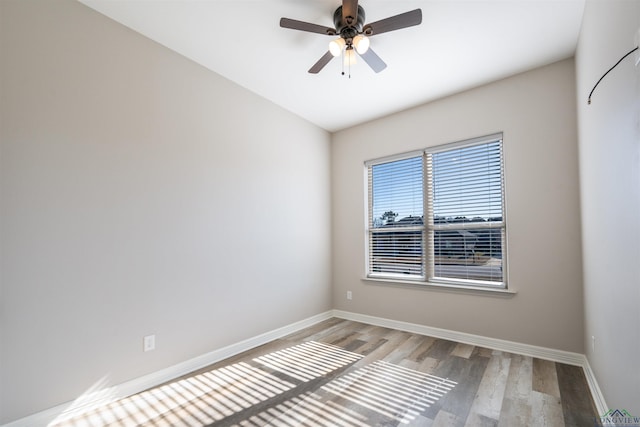 unfurnished room with ceiling fan and light hardwood / wood-style floors