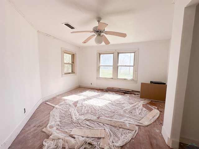 120 Louisiana St, Avinger, TX 75630 - spare room with visible vents, baseboards, a healthy amount of sunlight, and a ceiling fan