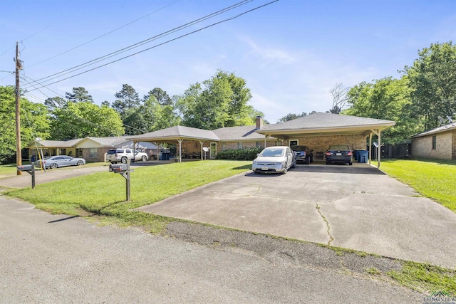 700-702 Pine Burr Ln, Kilgore, TX 75662 - ranch-style home featuring a front lawn, a carport, and driveway