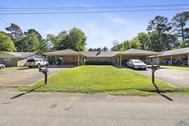 700-702 Pine Burr Ln, Kilgore, TX 75662 - single story home featuring concrete driveway, an attached carport, a front yard, and a chimney