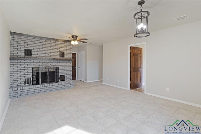 unfurnished living room with a brick fireplace and ceiling fan