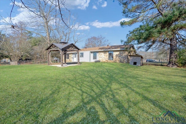 exterior space featuring a gazebo and a lawn