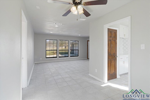 spare room featuring ceiling fan