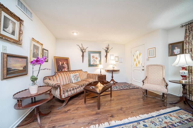 living room with dark wood-type flooring