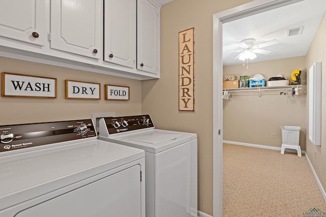 laundry area featuring ceiling fan, cabinets, and washing machine and dryer