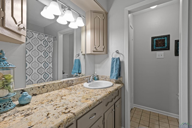 bathroom with tile patterned flooring, vanity, and a shower with curtain