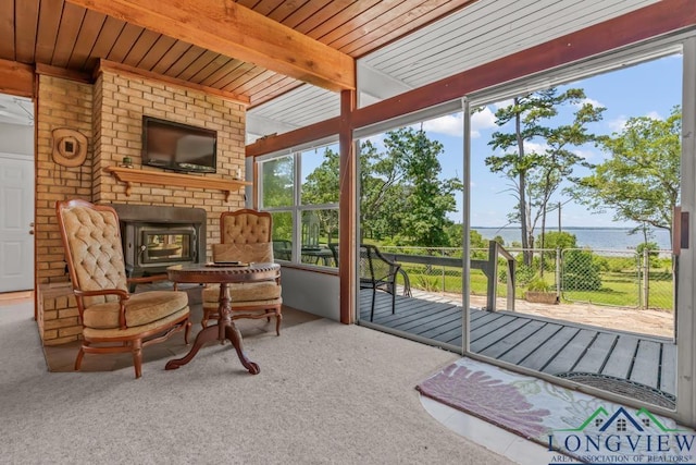 620 Shadywood Ln, Avinger, TX 75630 - sunroom / solarium with a brick fireplace and beamed ceiling