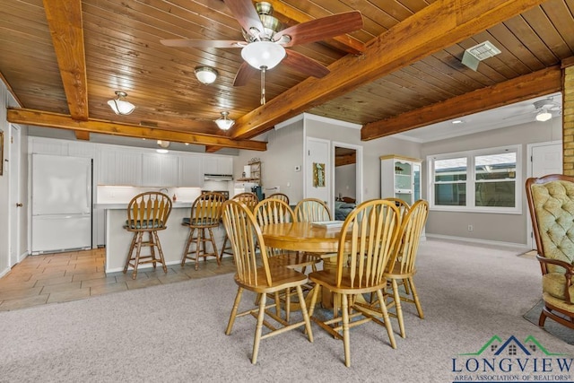 620 Shadywood Ln, Avinger, TX 75630 - dining area featuring a wooden ceiling with exposed beams, light colored carpet, and ceiling fan