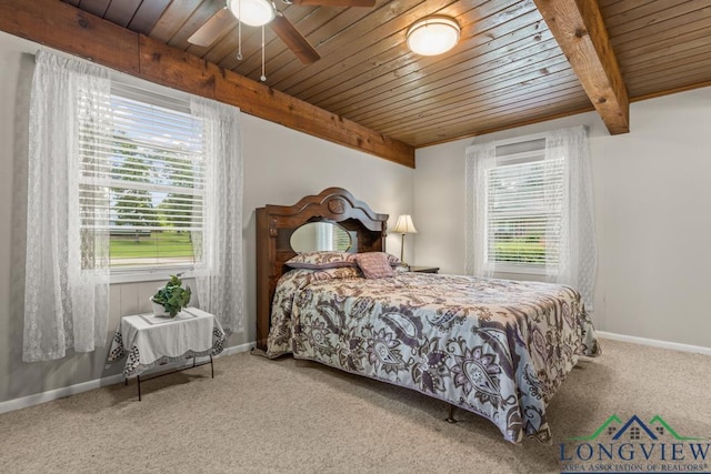 620 Shadywood Ln, Avinger, TX 75630 - bedroom featuring a wood ceiling with exposed beams, carpet floors, and multiple windows
