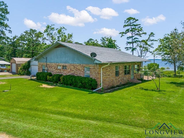 620 Shadywood Ln, Avinger, TX 75630 - view of front of house featuring brick siding, a front lawn, and a detached garage