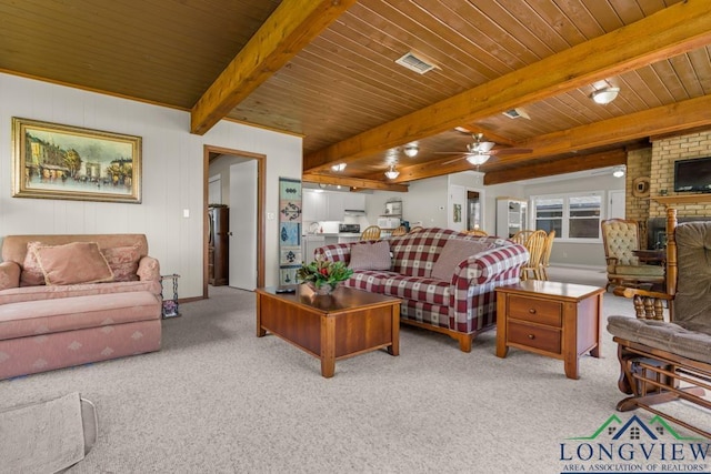 620 Shadywood Ln, Avinger, TX 75630 - living area featuring carpet flooring, a ceiling fan, a fireplace, and a wooden ceiling with exposed beams