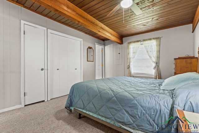 620 Shadywood Ln, Avinger, TX 75630 - carpeted bedroom with a wooden ceiling with exposed beams, a closet, and a ceiling fan