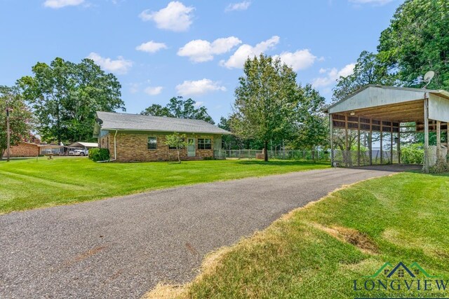 620 Shadywood Ln, Avinger, TX 75630 - view of front facade featuring driveway and a detached carport