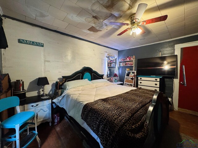 123 E 12th St, Mount Pleasant, TX 75455 - bedroom featuring dark wood-style flooring and ceiling fan