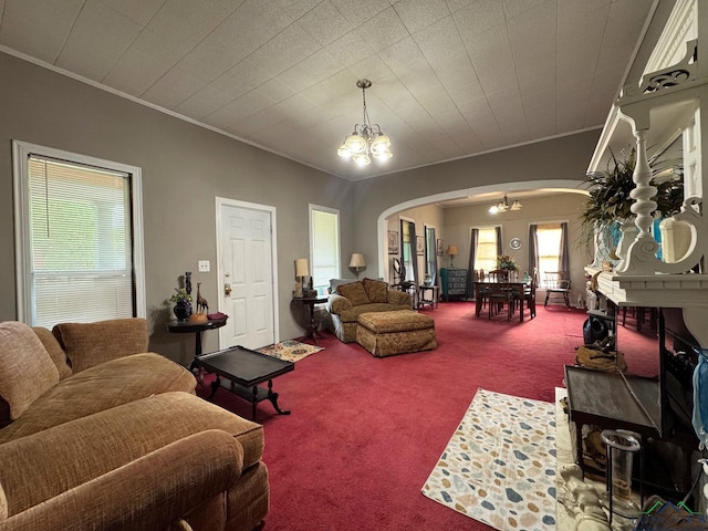 123 E 12th St, Mount Pleasant, TX 75455 - carpeted living area with arched walkways, crown molding, and a chandelier