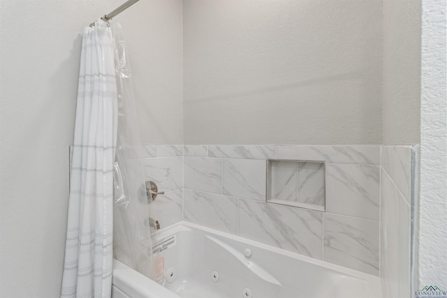 bathroom with shower / tub combo with curtain