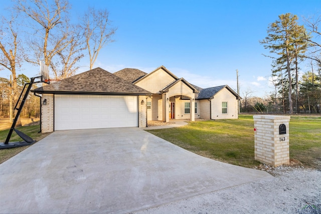 view of front of home featuring a garage and a front yard