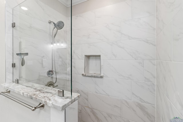 bathroom with tiled shower