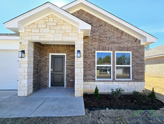 view of exterior entry with a garage