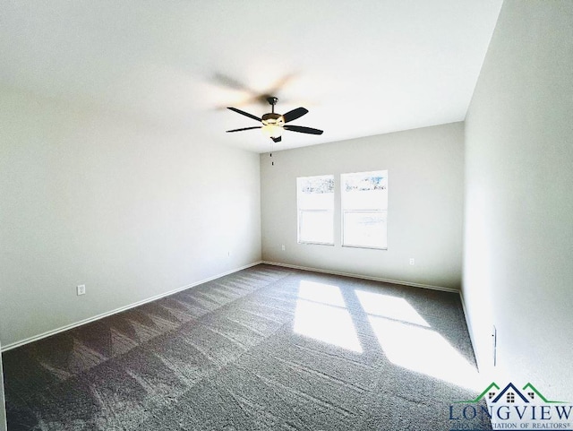 unfurnished room featuring ceiling fan and dark carpet