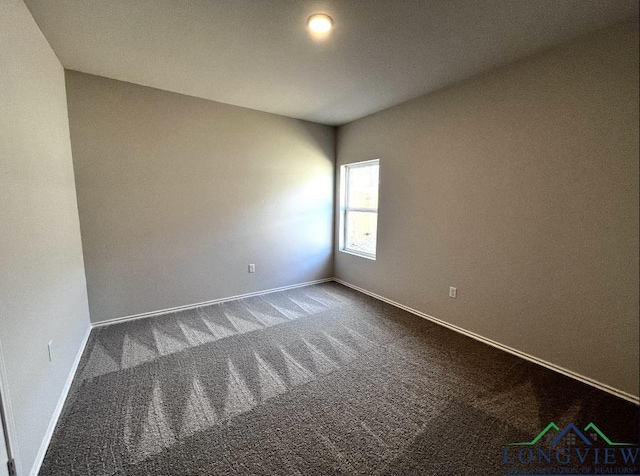 unfurnished room featuring carpet