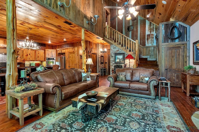 1355 Snapdragon Rd, Diana, TX 75640 - living area with stairs, wooden walls, wooden ceiling, and wood finished floors