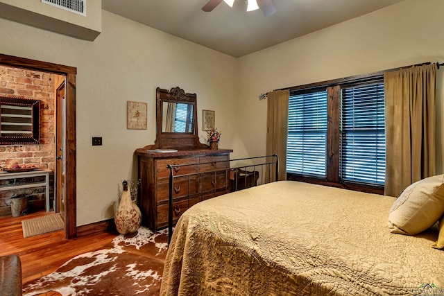1355 Snapdragon Rd, Diana, TX 75640 - bedroom with a ceiling fan, baseboards, visible vents, and wood finished floors