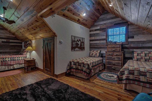 1355 Snapdragon Rd, Diana, TX 75640 - bedroom featuring lofted ceiling, wood walls, wood ceiling, and hardwood / wood-style flooring