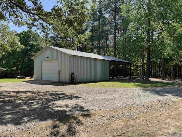 1355 Snapdragon Rd, Diana, TX 75640 - detached garage with gravel driveway