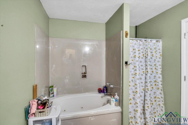 bathroom featuring separate shower and tub and a textured ceiling