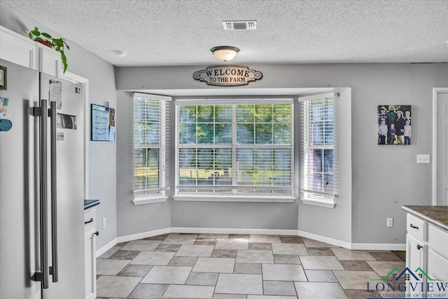 unfurnished dining area with a wealth of natural light