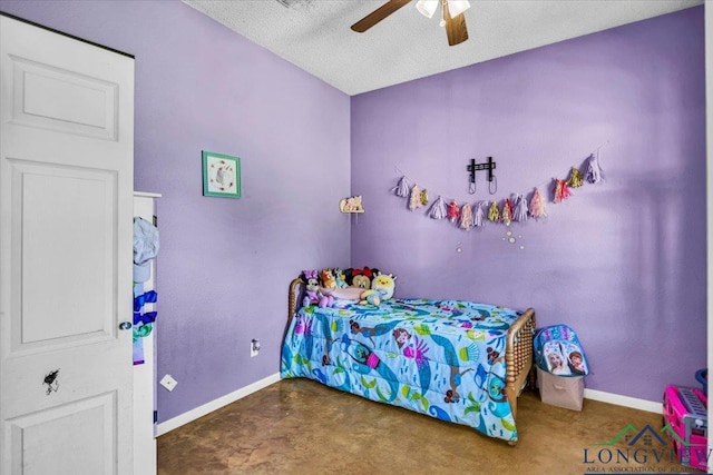 bedroom featuring ceiling fan and a textured ceiling