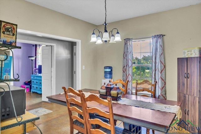 dining space with a chandelier and wood-type flooring