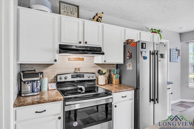 kitchen with tasteful backsplash, white cabinetry, a textured ceiling, and appliances with stainless steel finishes